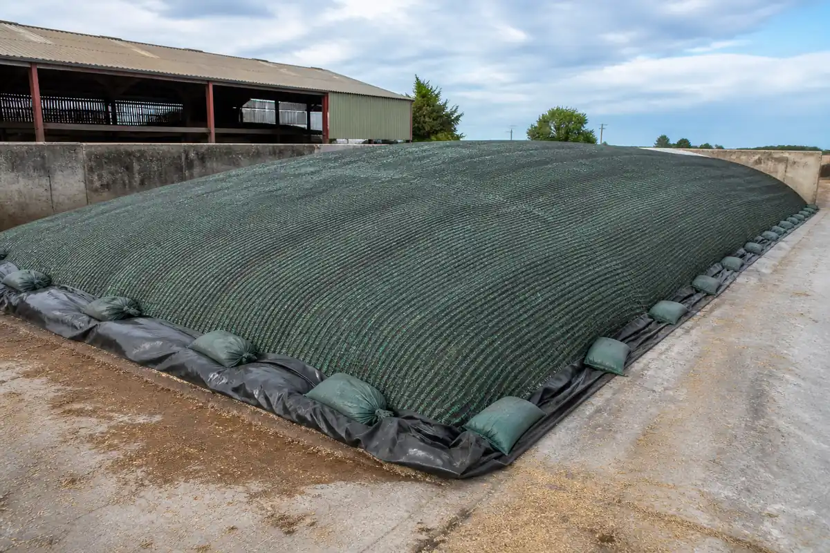 HDPE silo net covering an outdoor silage pile