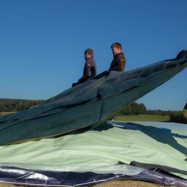 HDPE Silo Net Installation On A Silage Cover HDPE silo net installation on a silage cover
