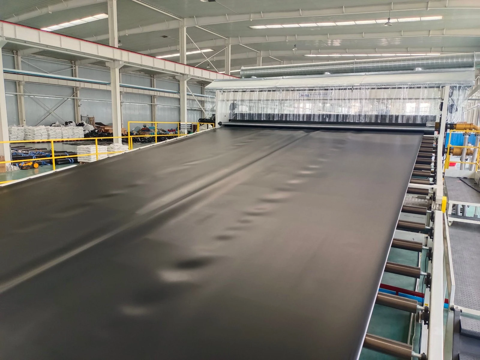 Flat extrusion geomembrane production line inside the Taiji factory
