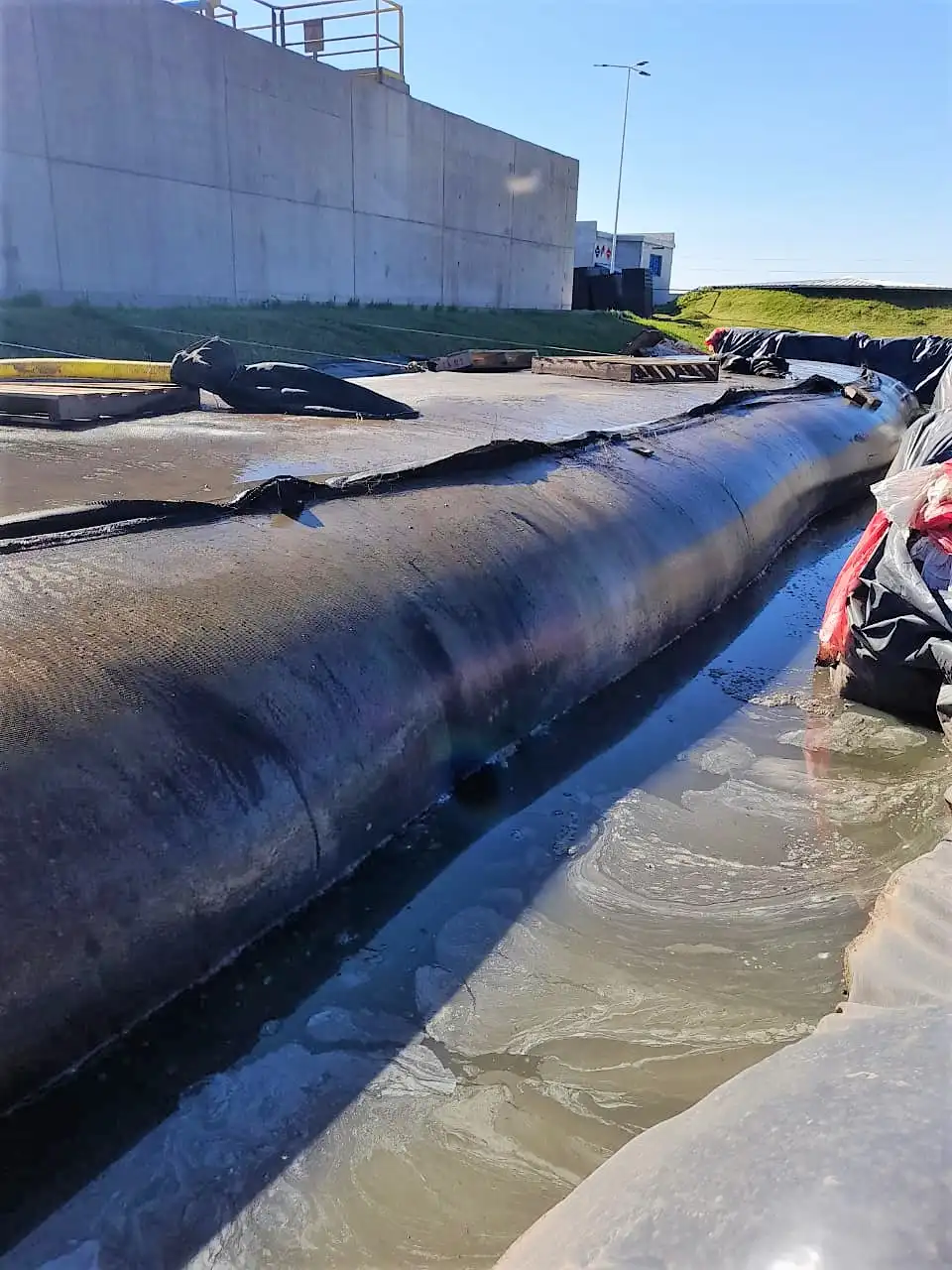 geotube industrial sludge pumping filling plant yard image 4