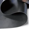 Rolled LLDPE geomembrane sheet on a white background