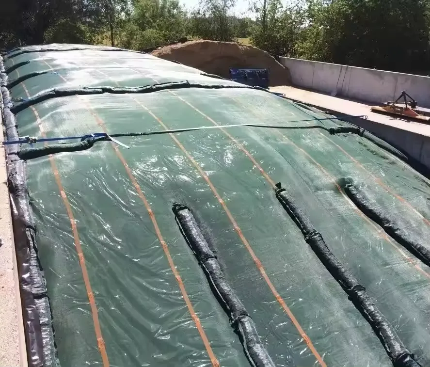 Silo gravel bags reinforcing a silage pit cover 1